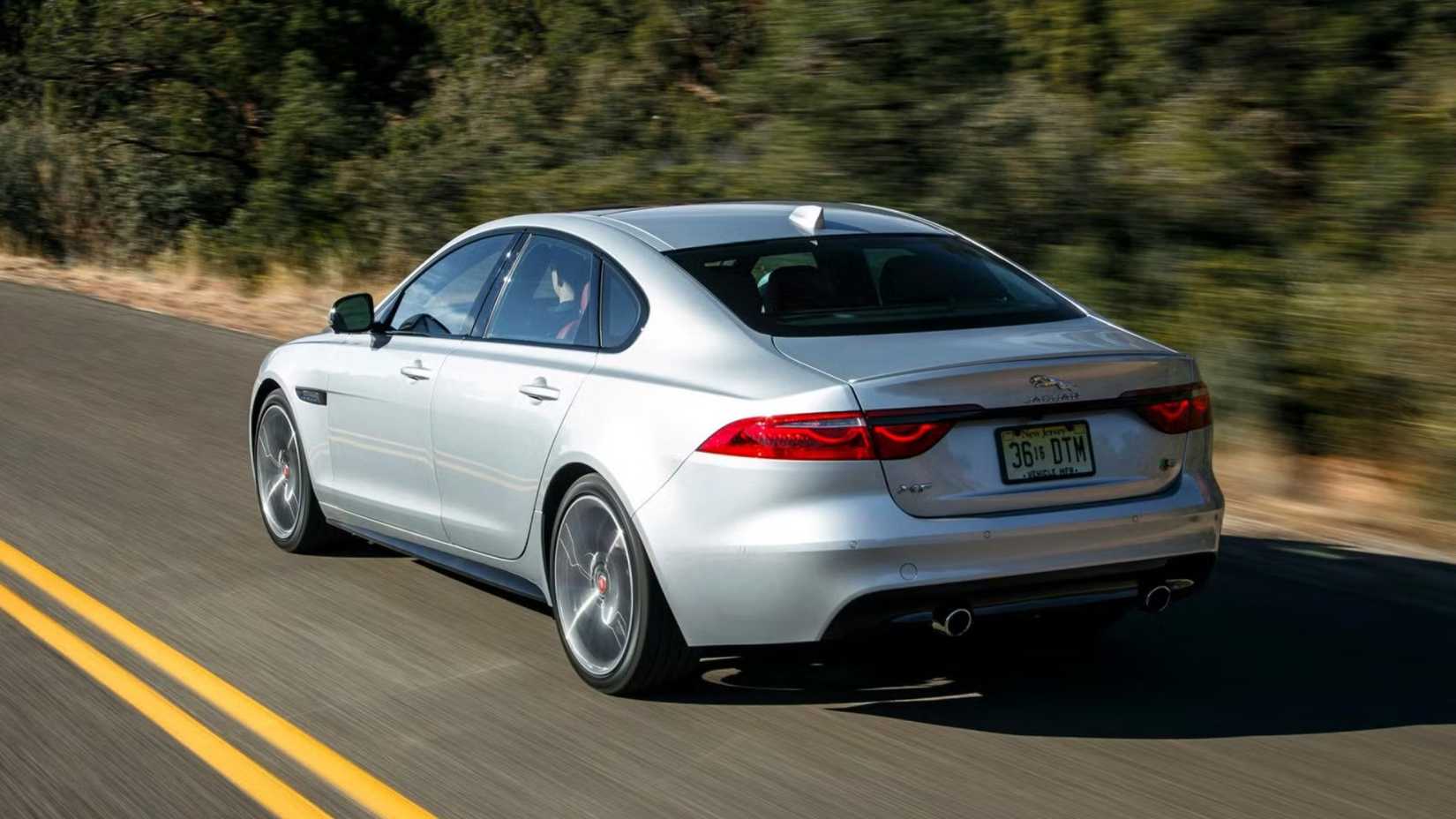 2019 Jaguar XF S rear third quarter accelerating view