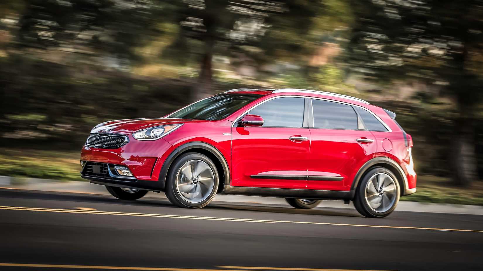 2019 Kia Niro Hybrid in red being driven