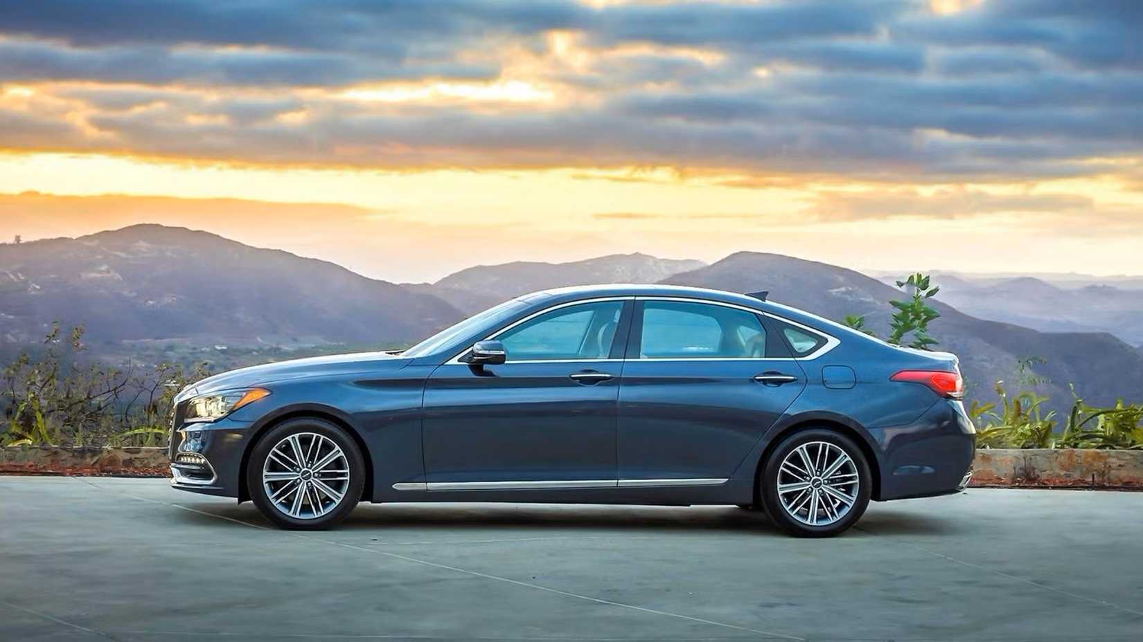 Gray 2020 Genesis G80 side shot parked in front of horizon