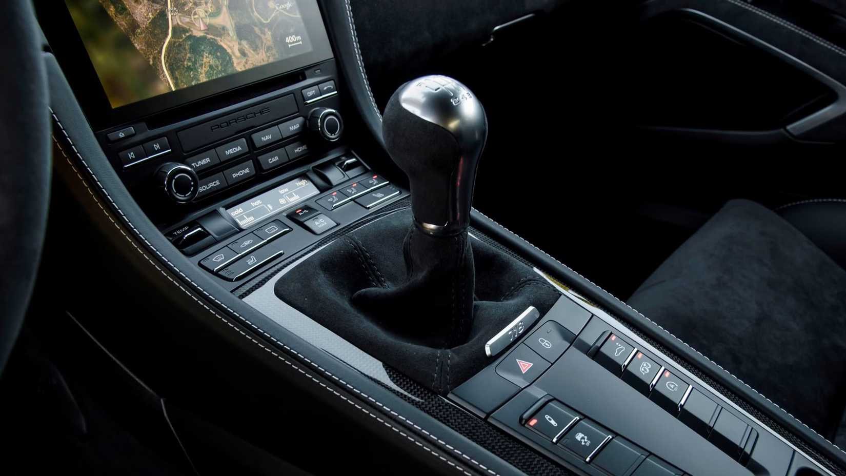 A detail view of the manual shifter of a 2023 Porsche 718 Cayman GTS