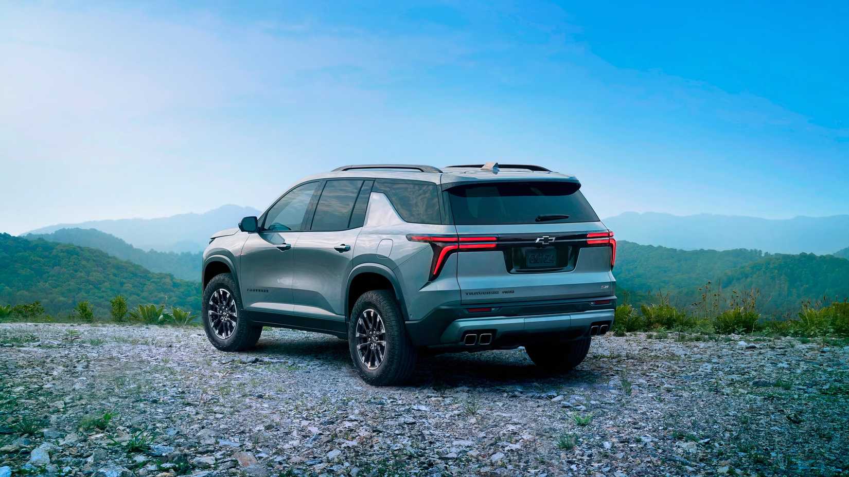 2025 Chevrolet Traverse in silver parked off-road