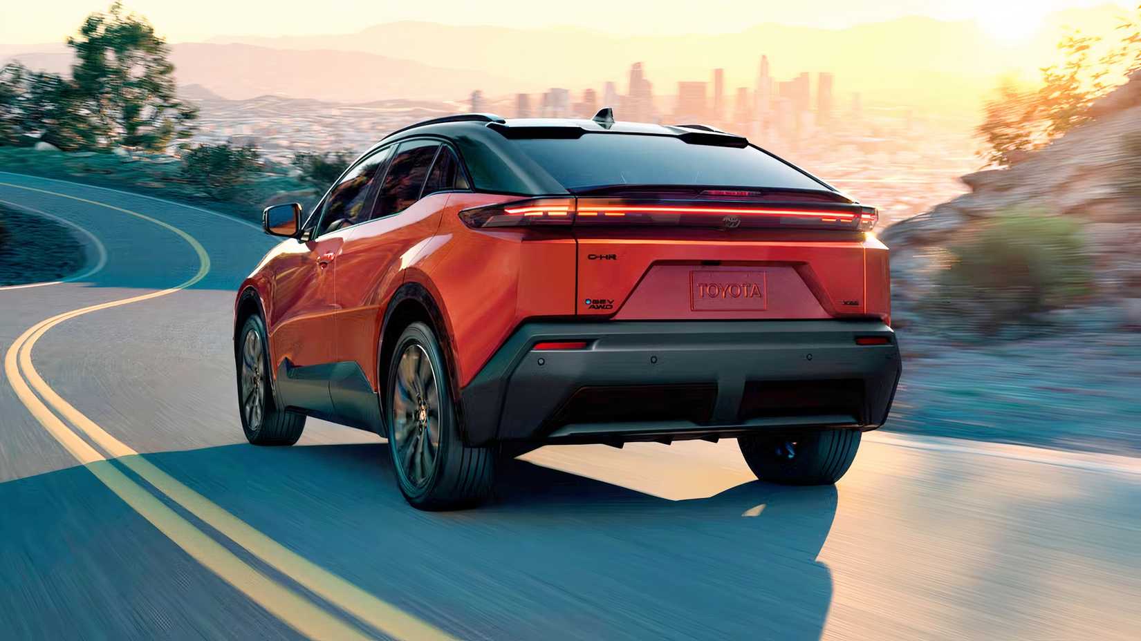 Rear three-quarters shot of a 2026 Toyota C-HR BEV driving