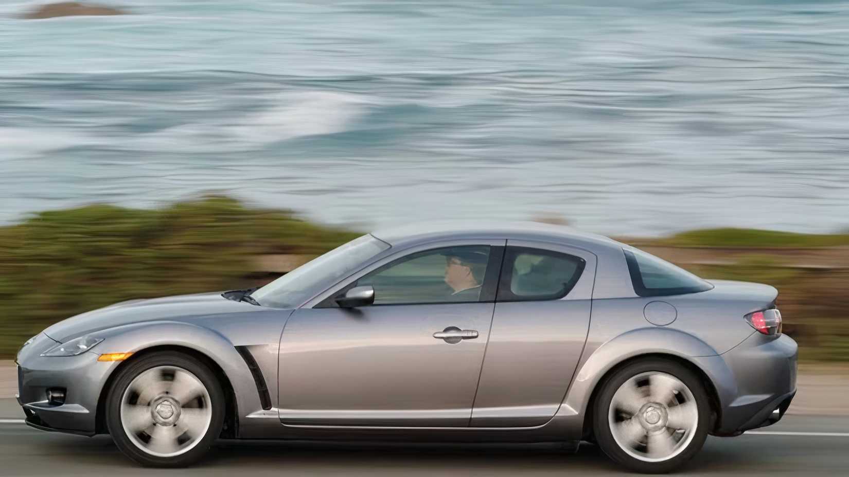 Mazda RX-8 in silver driving on road