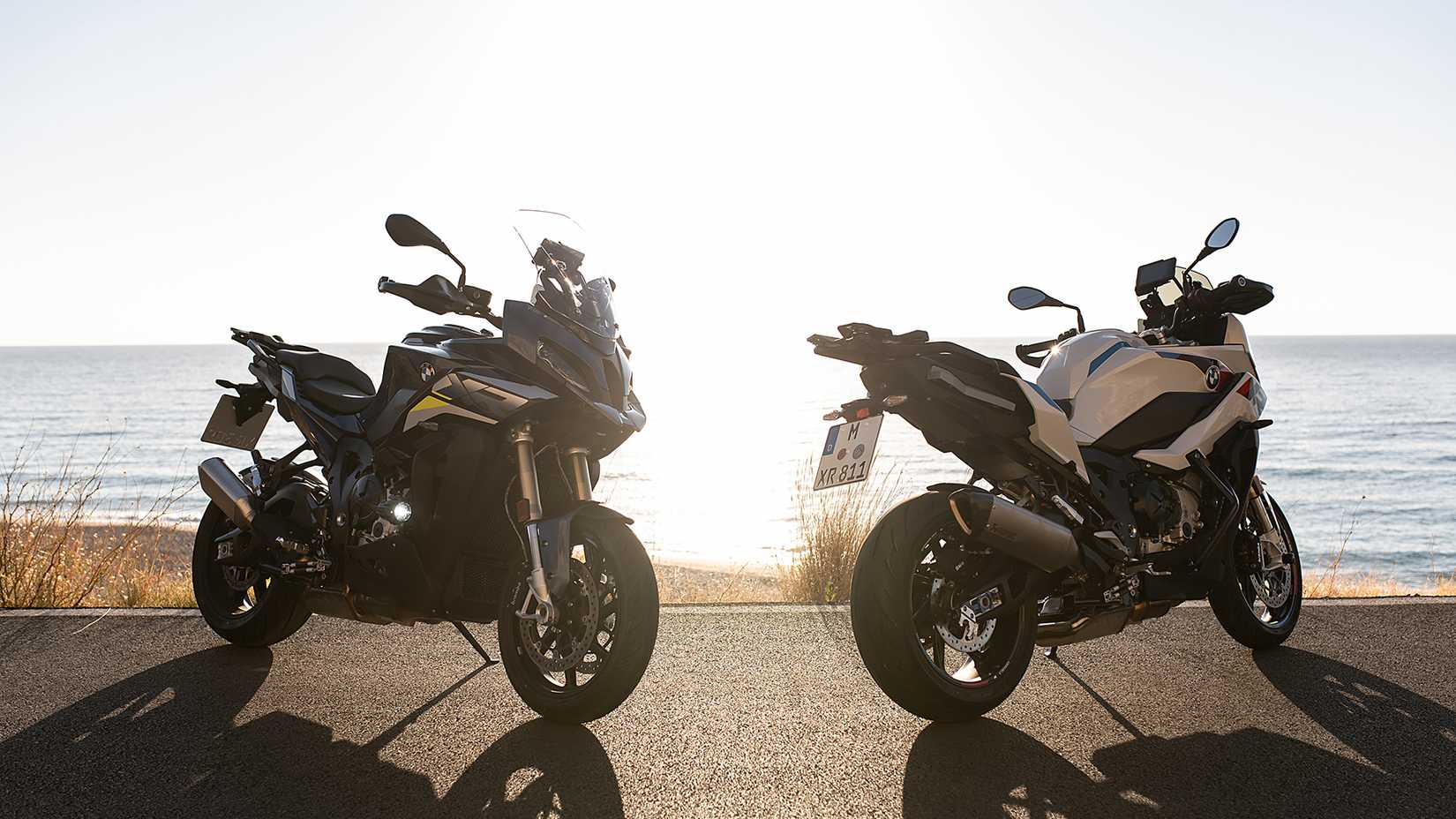 Static shot of BMW S 1000 XR front and rear right 3q overlooking the ocean