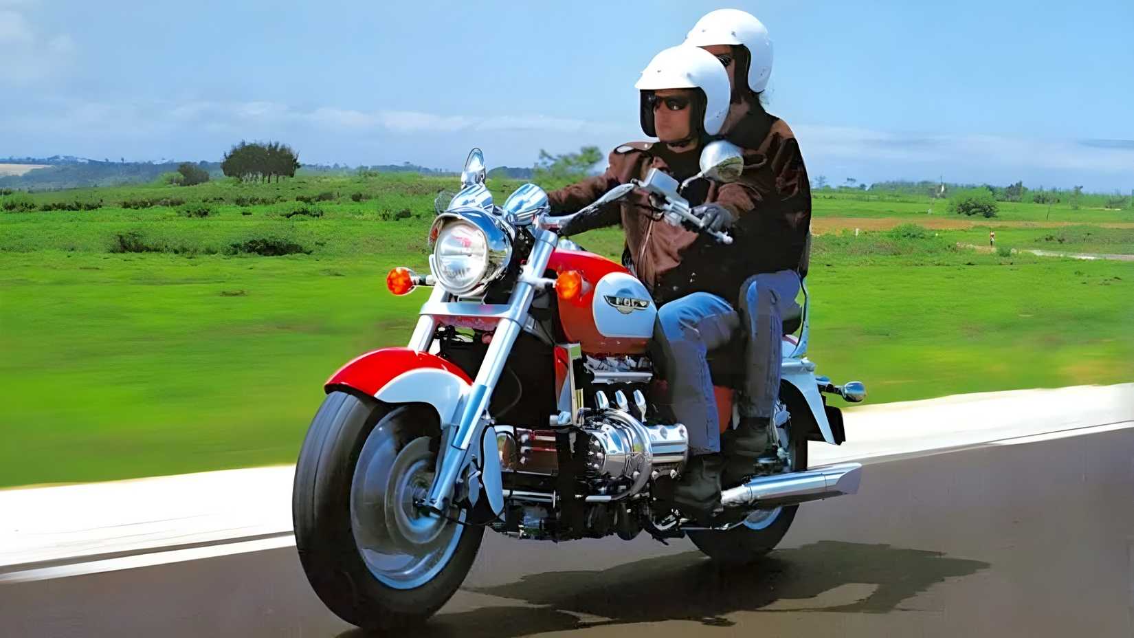 Honda Valkyrie crusing with pillion on board front third quarter view