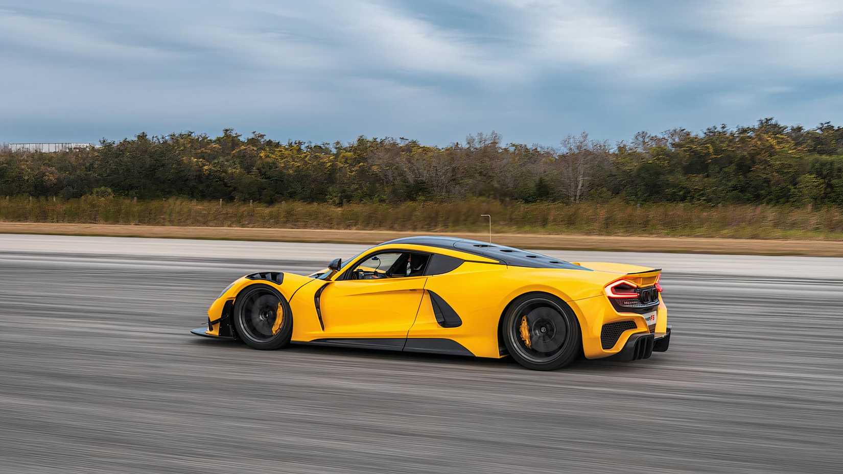 2025 Hennessey Venom F5 Evolution in yellow driving on track