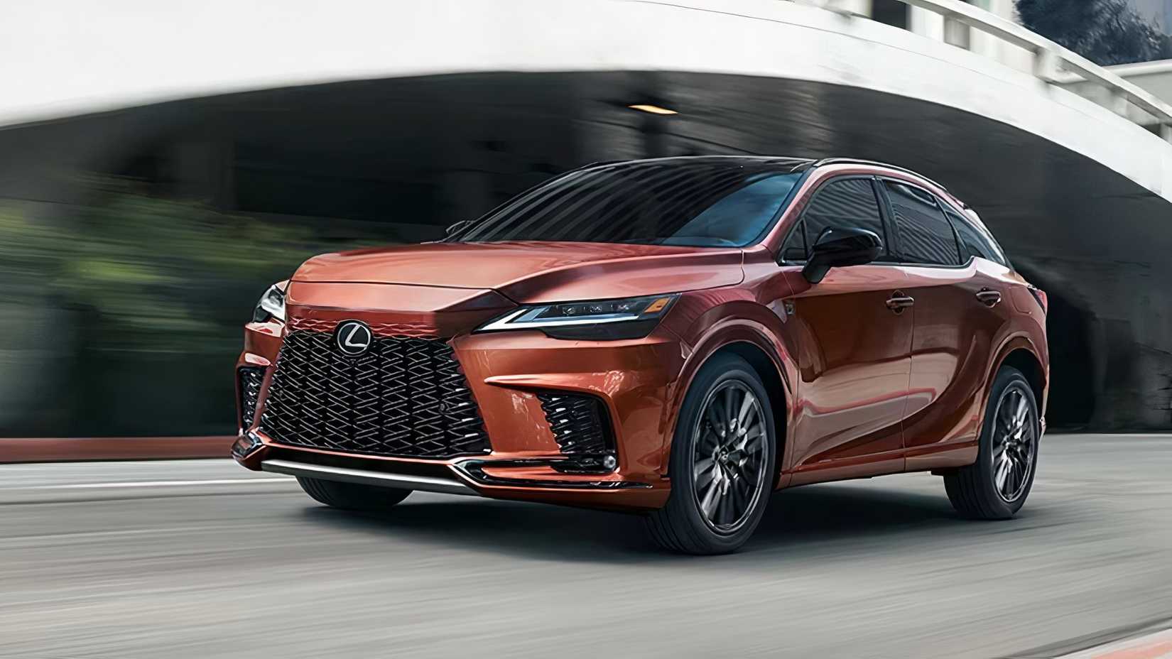 2025 Lexus RX in orange driving on city road