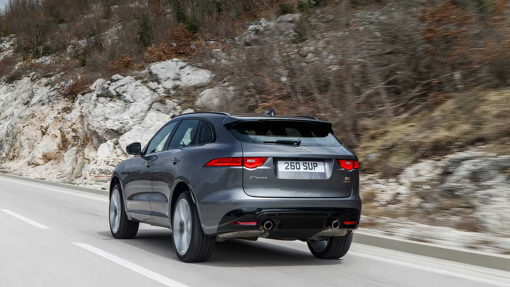 2017 Jaguar F-Pace S in silver driving on mountain road