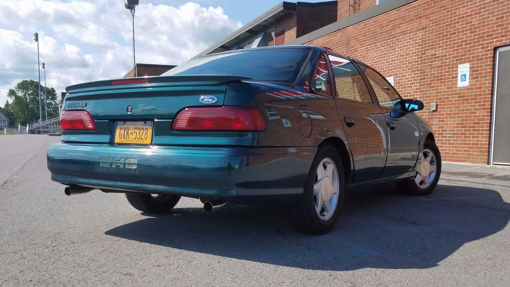 1994 Ford Taurus SHO in blue parked