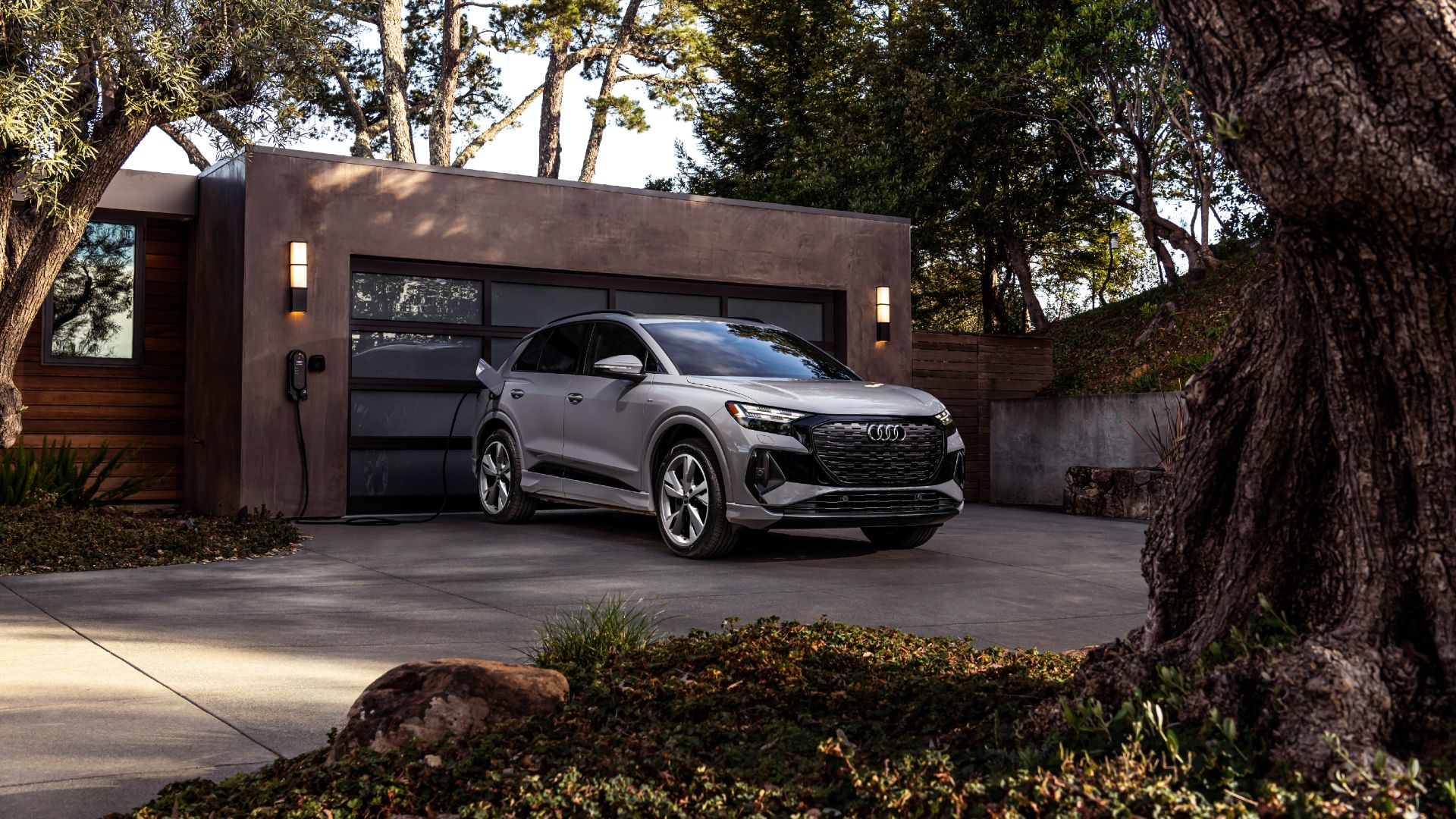 2023 Audi Q4 50 e-tron Exterior Charging In Driveway