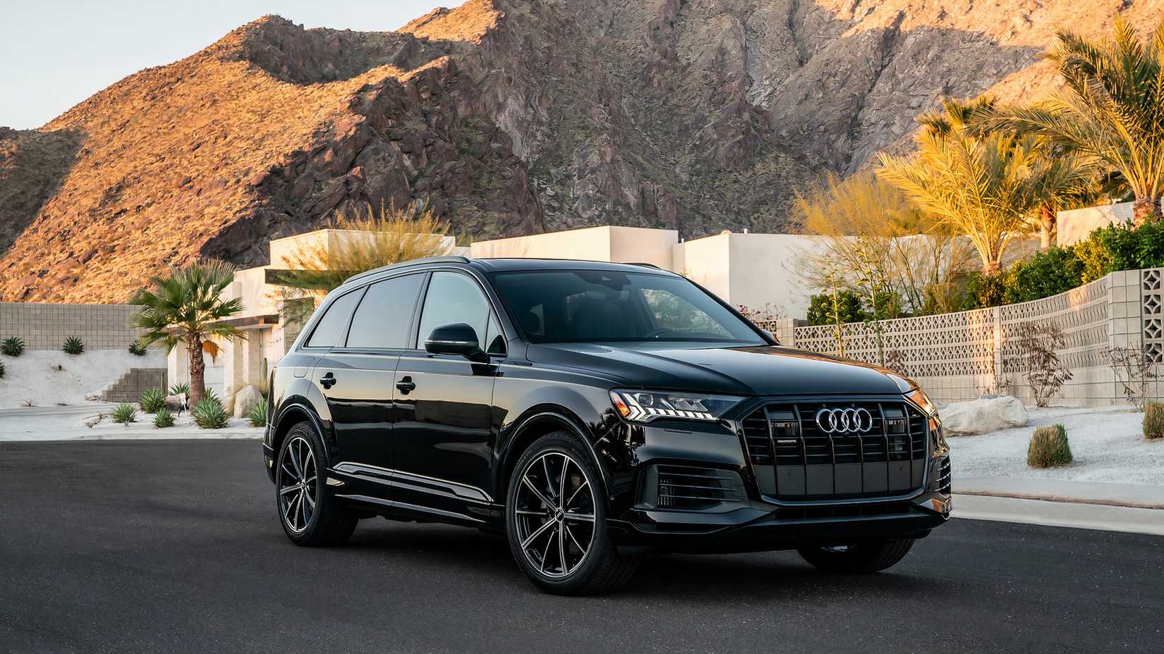 Front 3/4 shot of a 2021 Audi Q7 parked in front of house