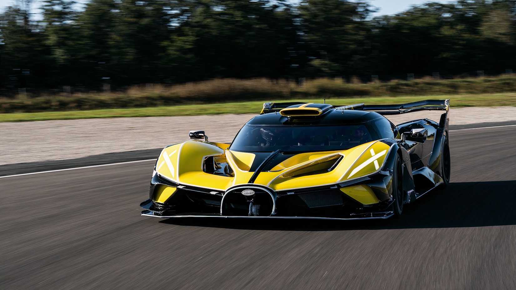 Bugatti Bolide in yellow driving on racetrack