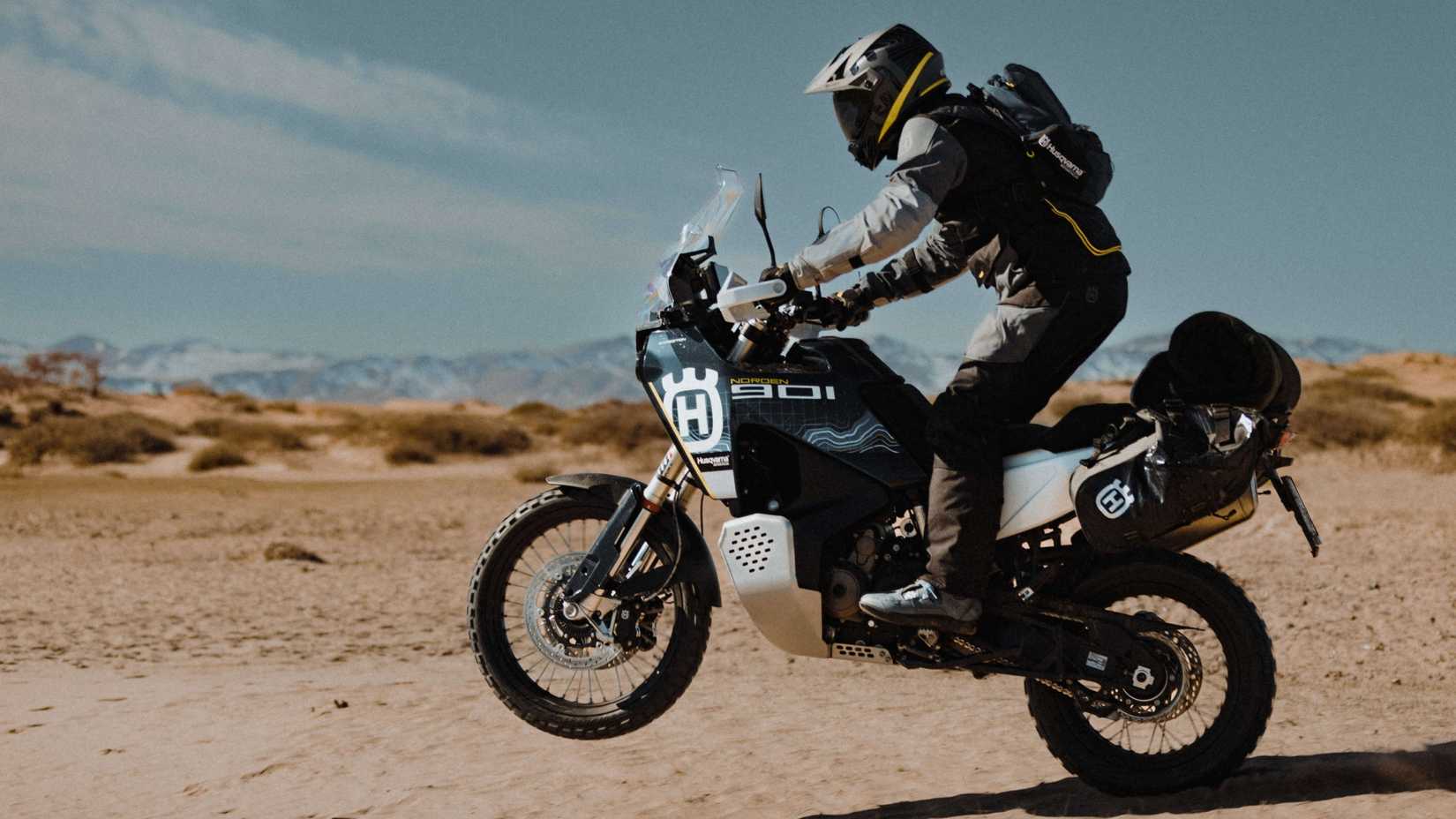 Husqvarna Norden 901 Expedition popping a wheelie side profile view