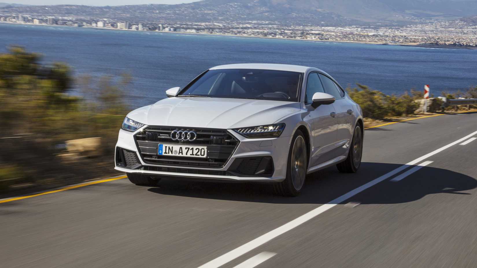 Front shot of the 2025 Audi A7 driving on the road