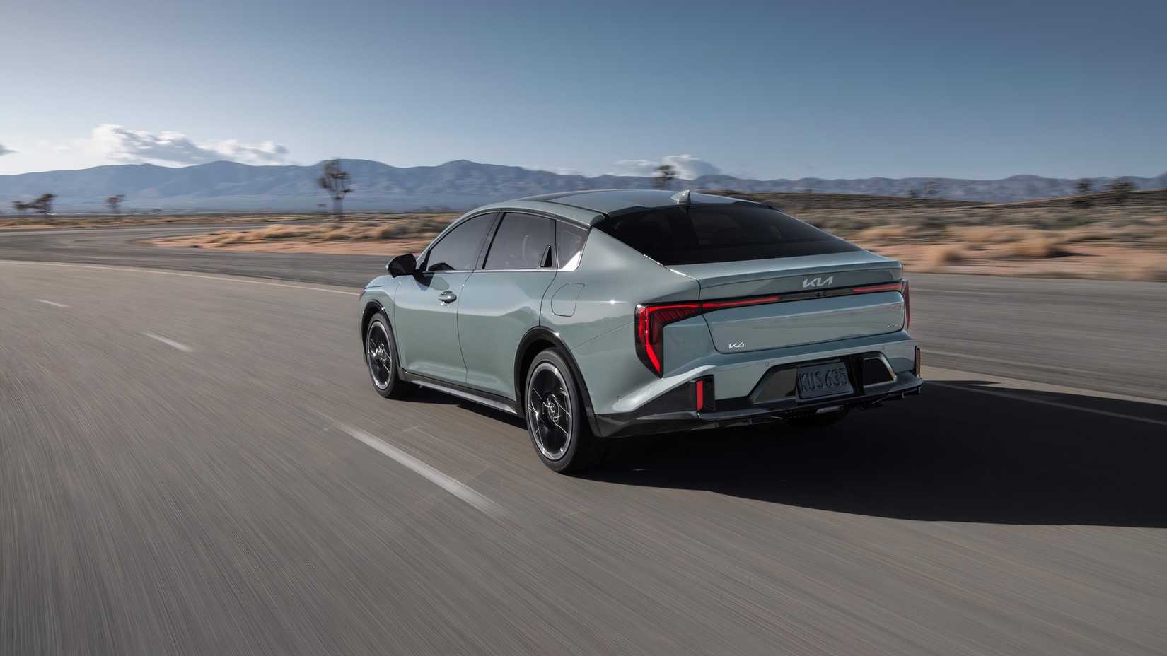 2025 Kia K4 in gray being driven on road