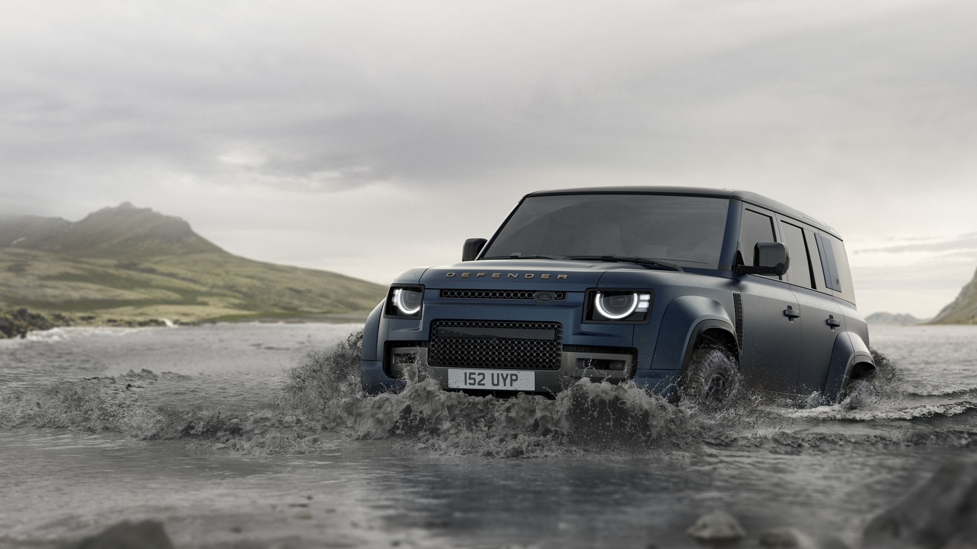 2026 Land Rover Defender in blue wading through water