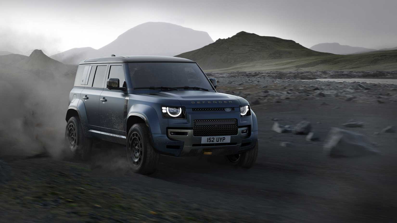 Front 3/4 action shot of 2026 Land Rover Defender front driving off-road