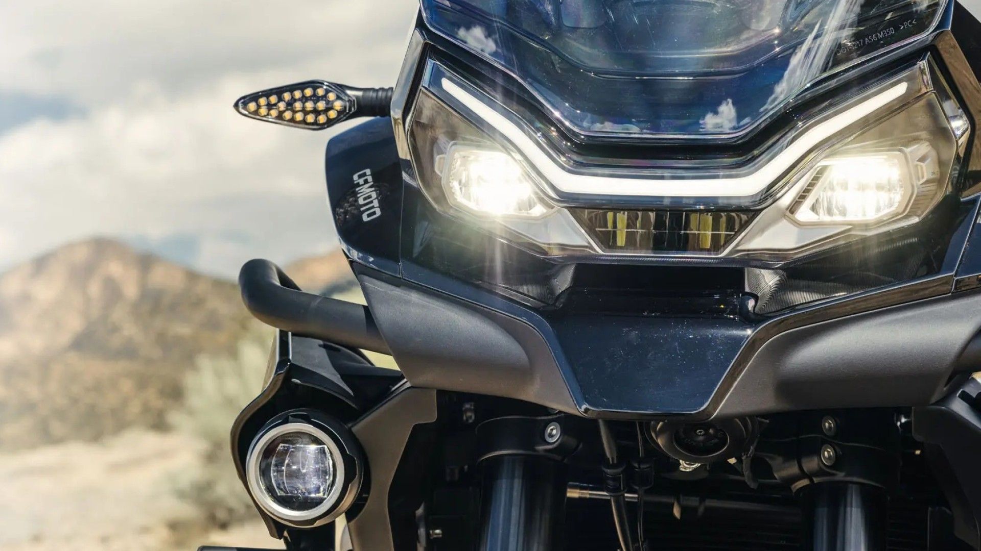 2025 CFMoto Ibex 800 E dual-pot LED headlamp design close-up shot