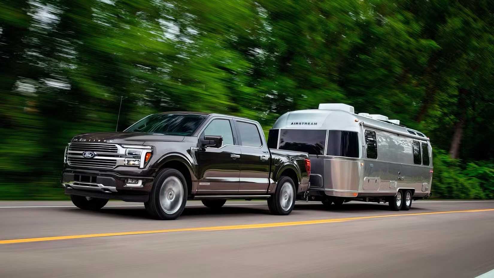 2025 Ford F-150 Platinum in black towing a trailer