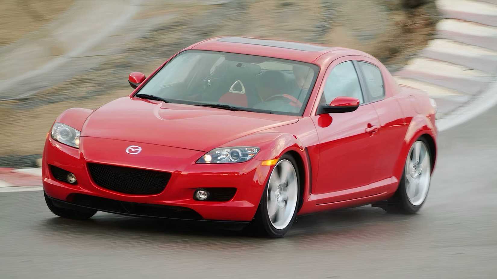 2008 Mazda RX-8 in red driving on track