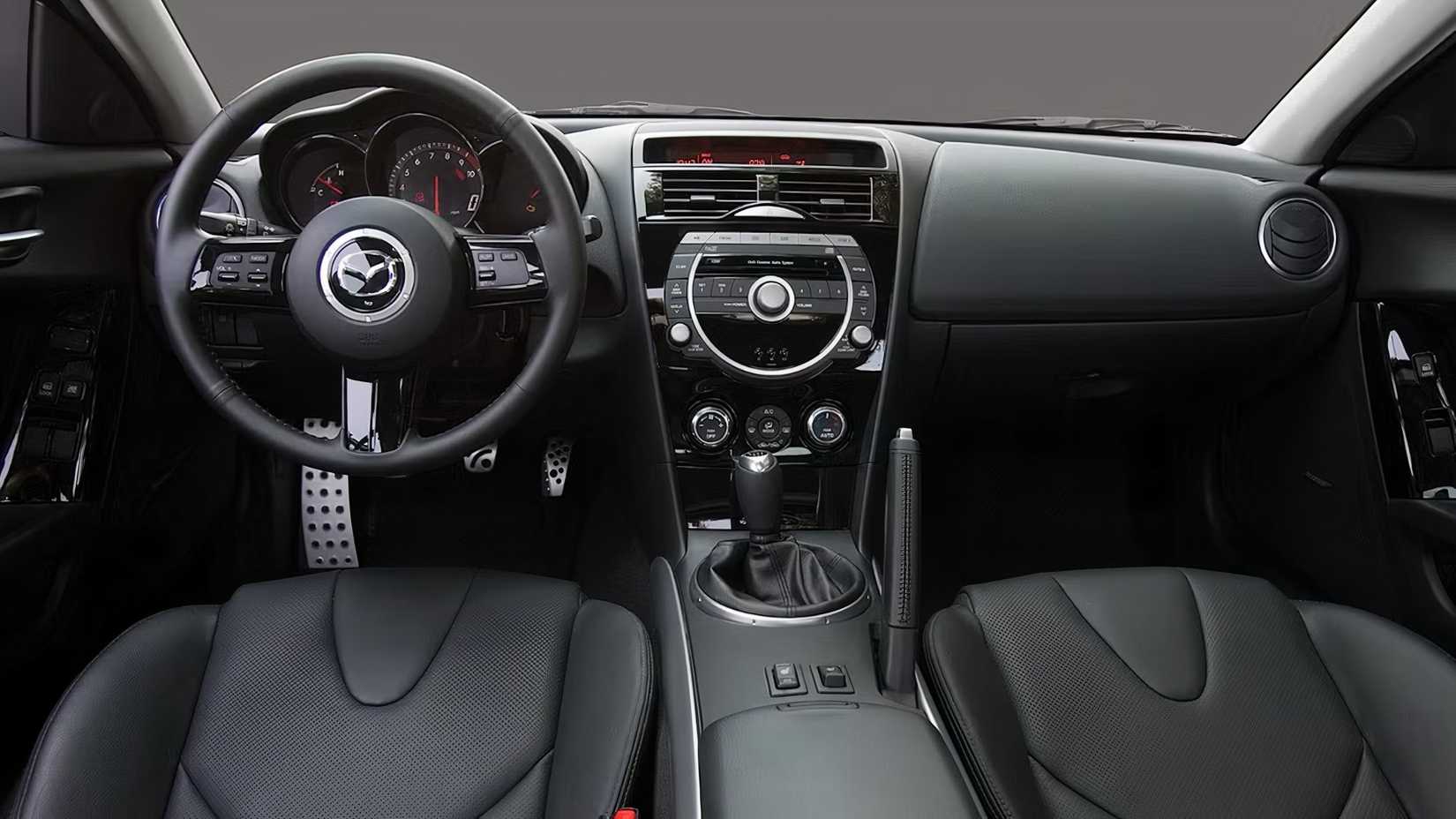 Mazda RX-8 interior showing front seats and controls