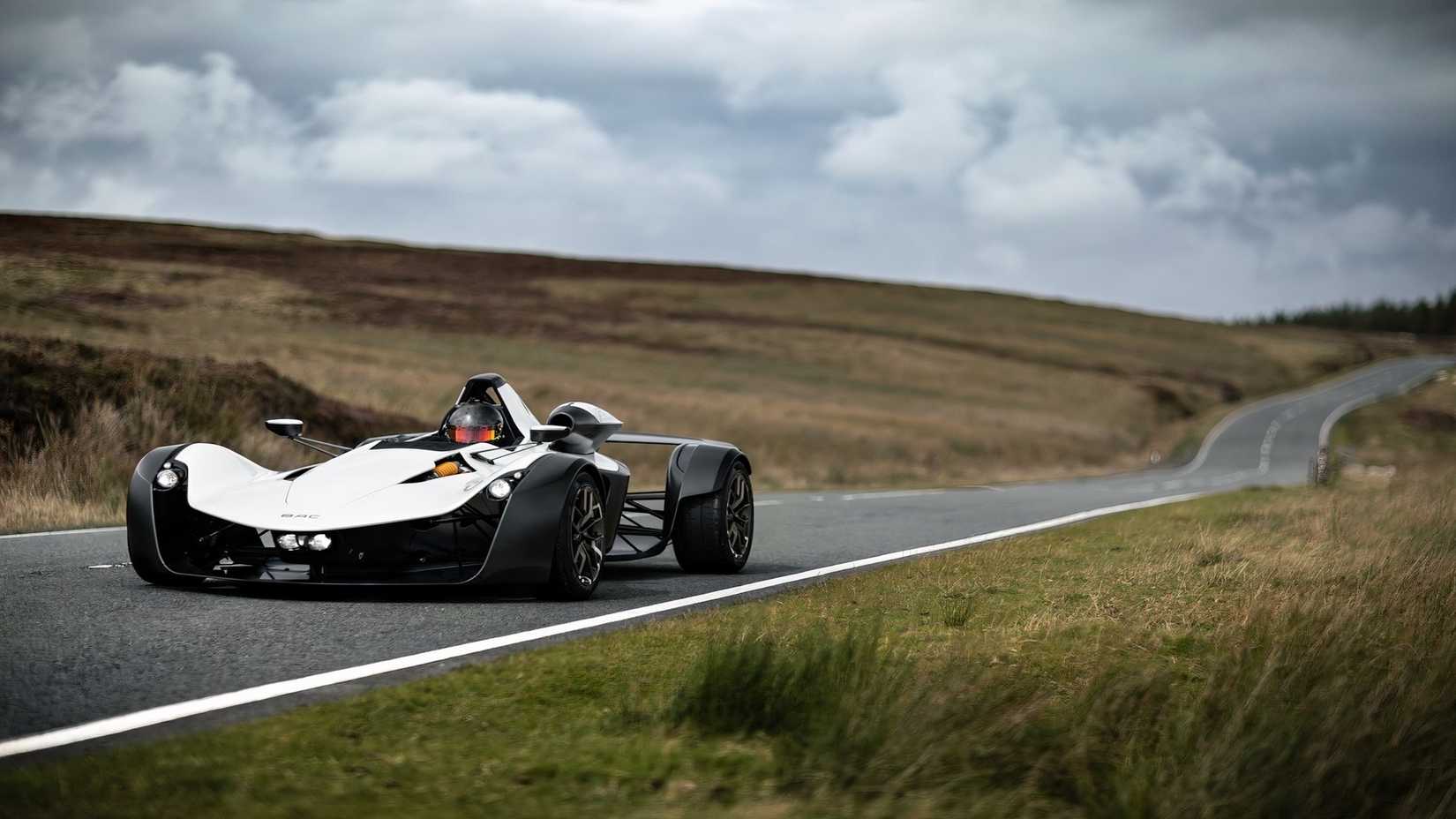BAC Mono in white driving on country road