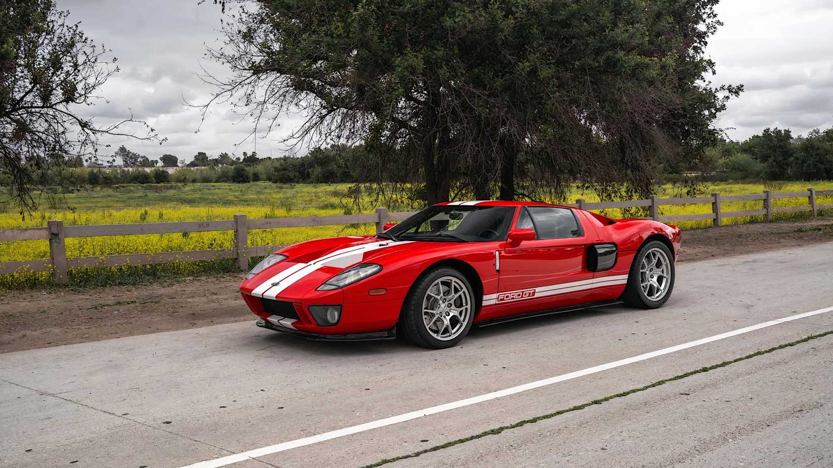 2006 Ford GT in red driving on road