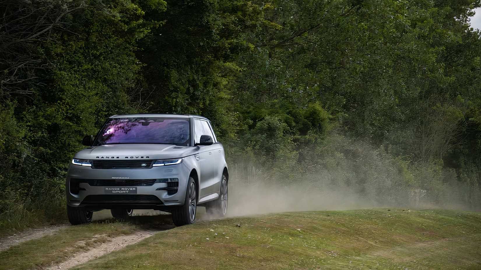 2025 Land Rover Range Rover Sport in silver driving in field