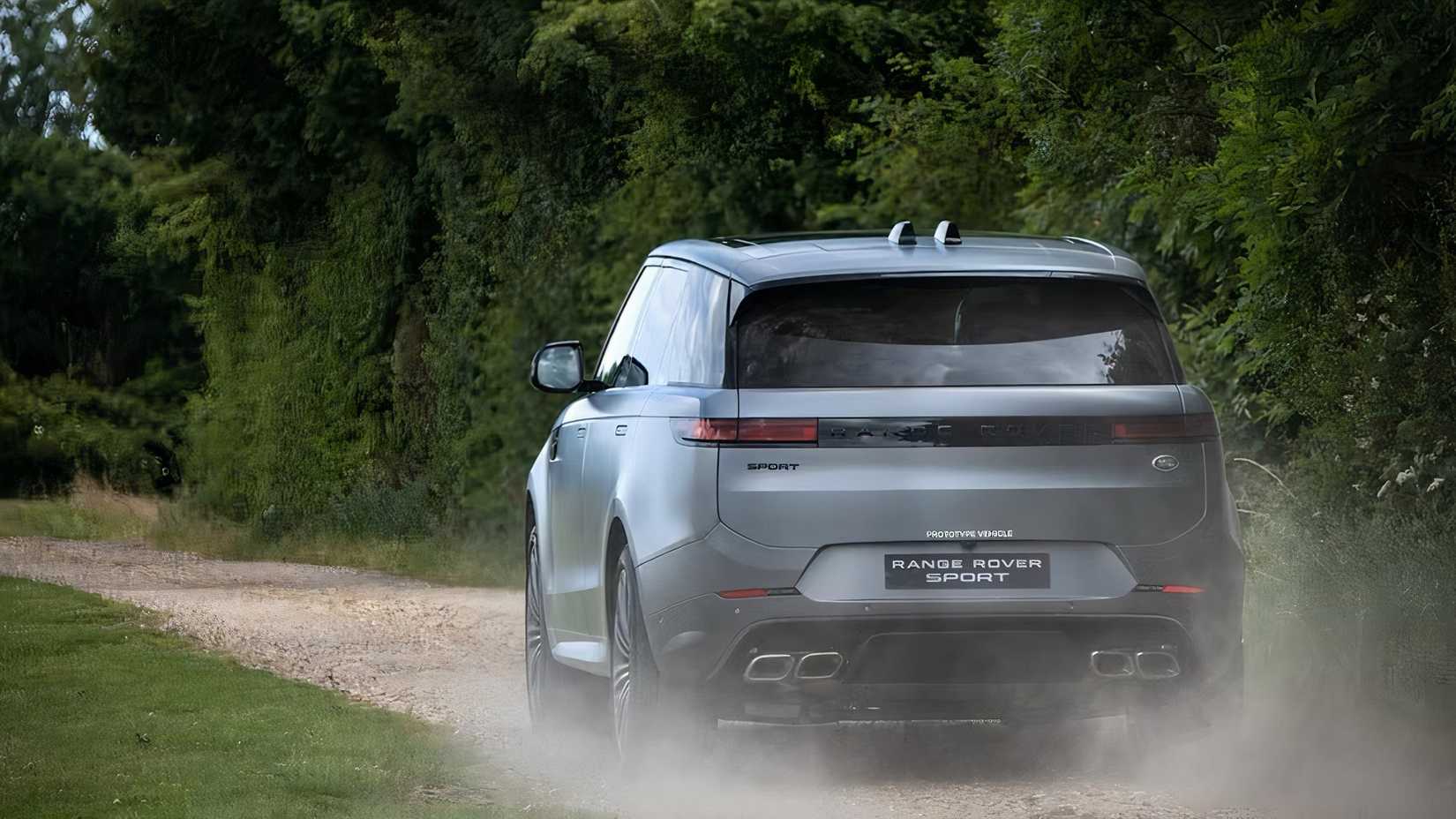 2025 Land Rover Range Rover Sport in silver driving in field