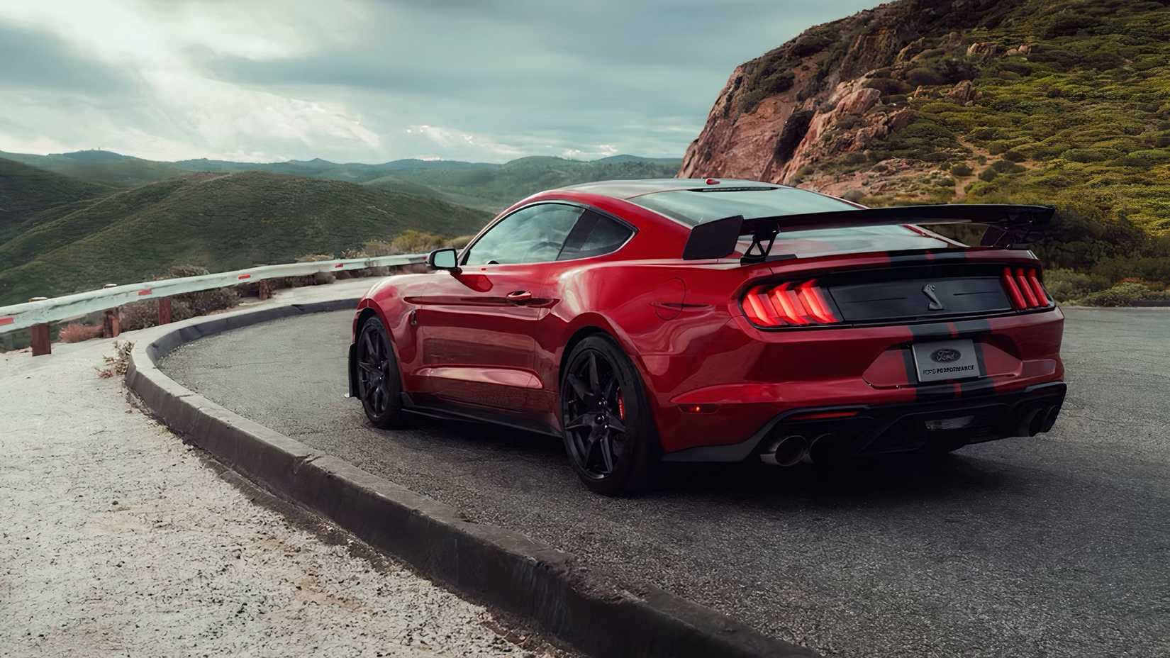2020 Ford Mustang Shelby GT500 in red driving on road