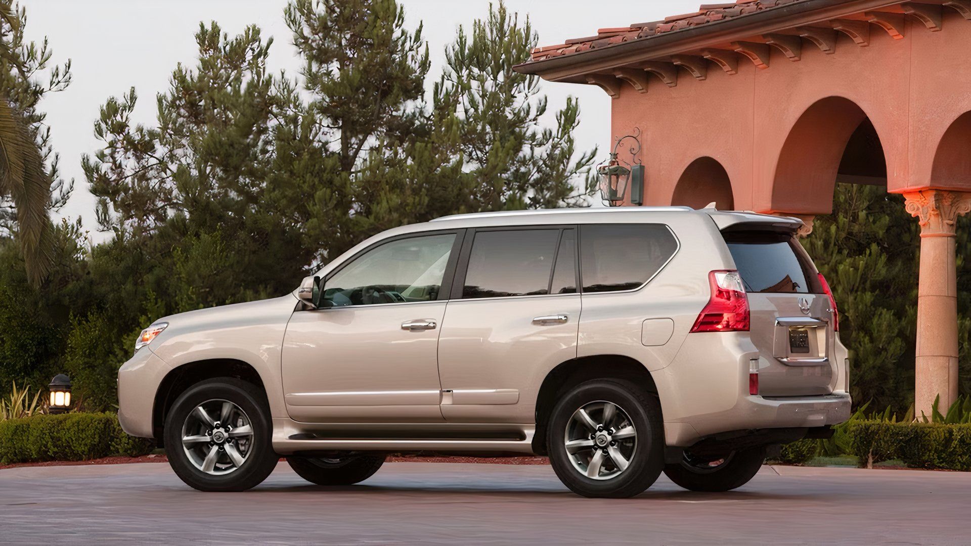 Rear 3/4 shot of 2012 Lexus GX in silver parked