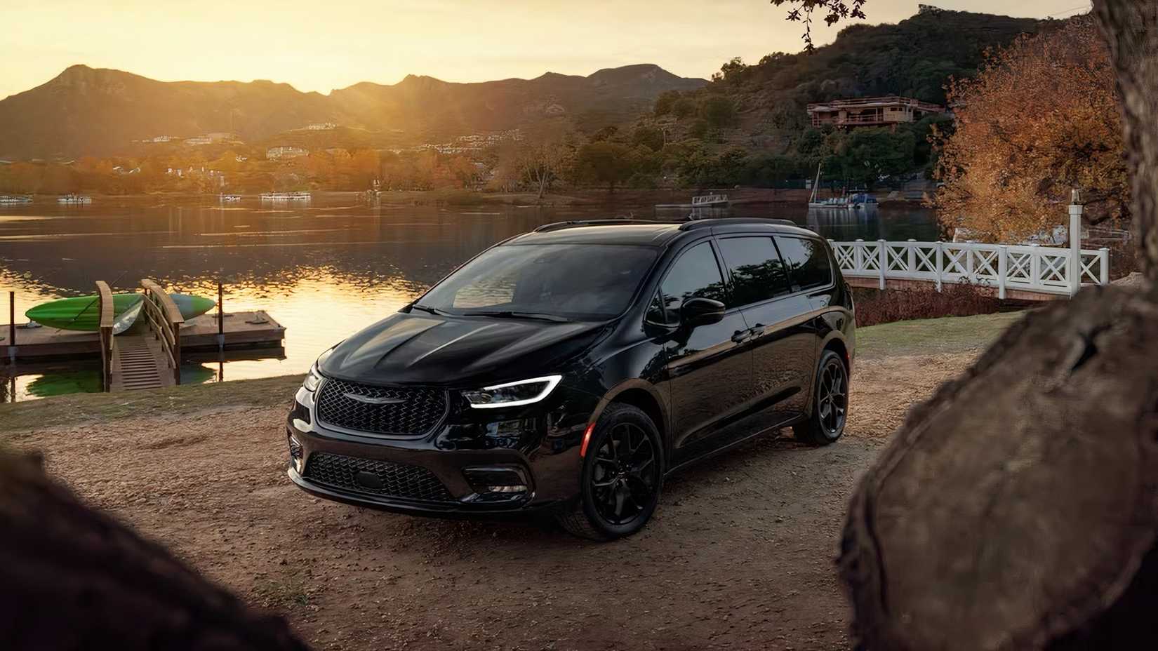 2025 Chrysler Pacifica in black parked by lake