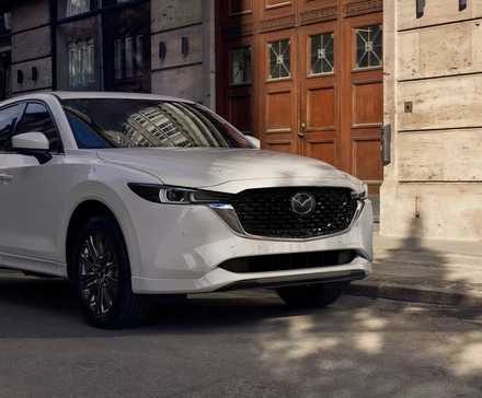 2022 Mazda CX-5 in white parked on city street