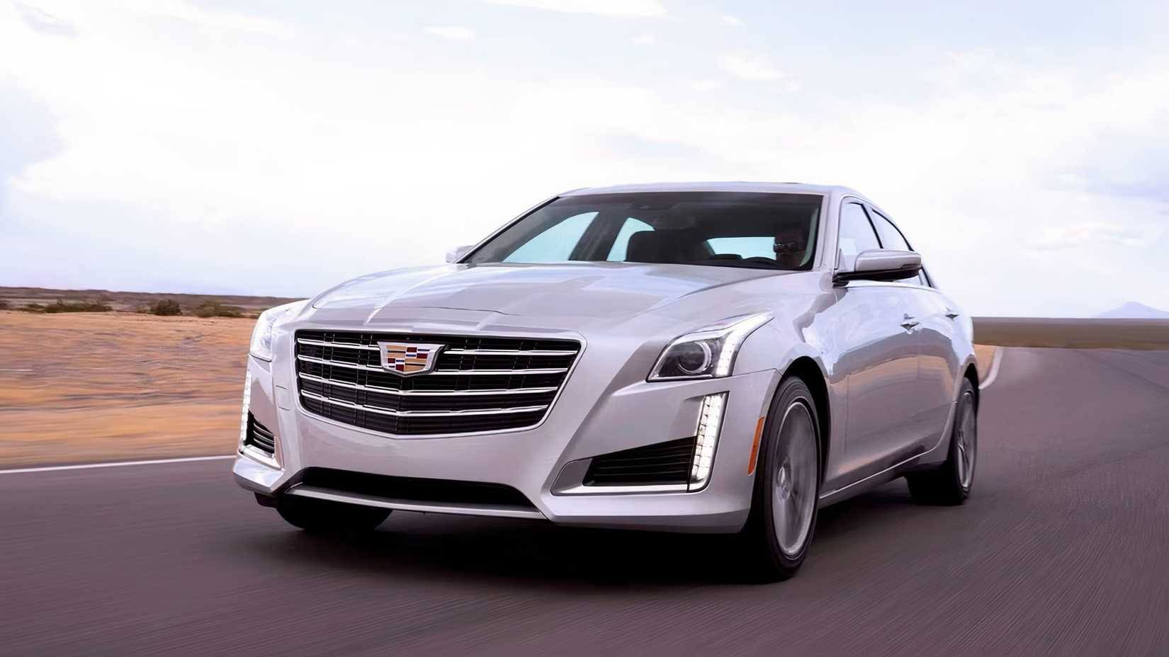 2017 Cadillac CTS in silver driving on road 