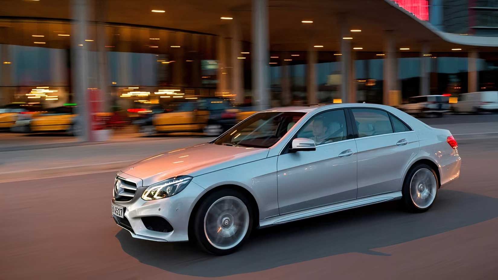 2016 Mercedes-Benz E-Class in silver driving in city