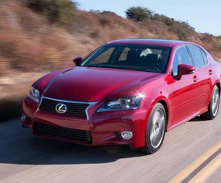 2015 Lexus GS in red driving on road