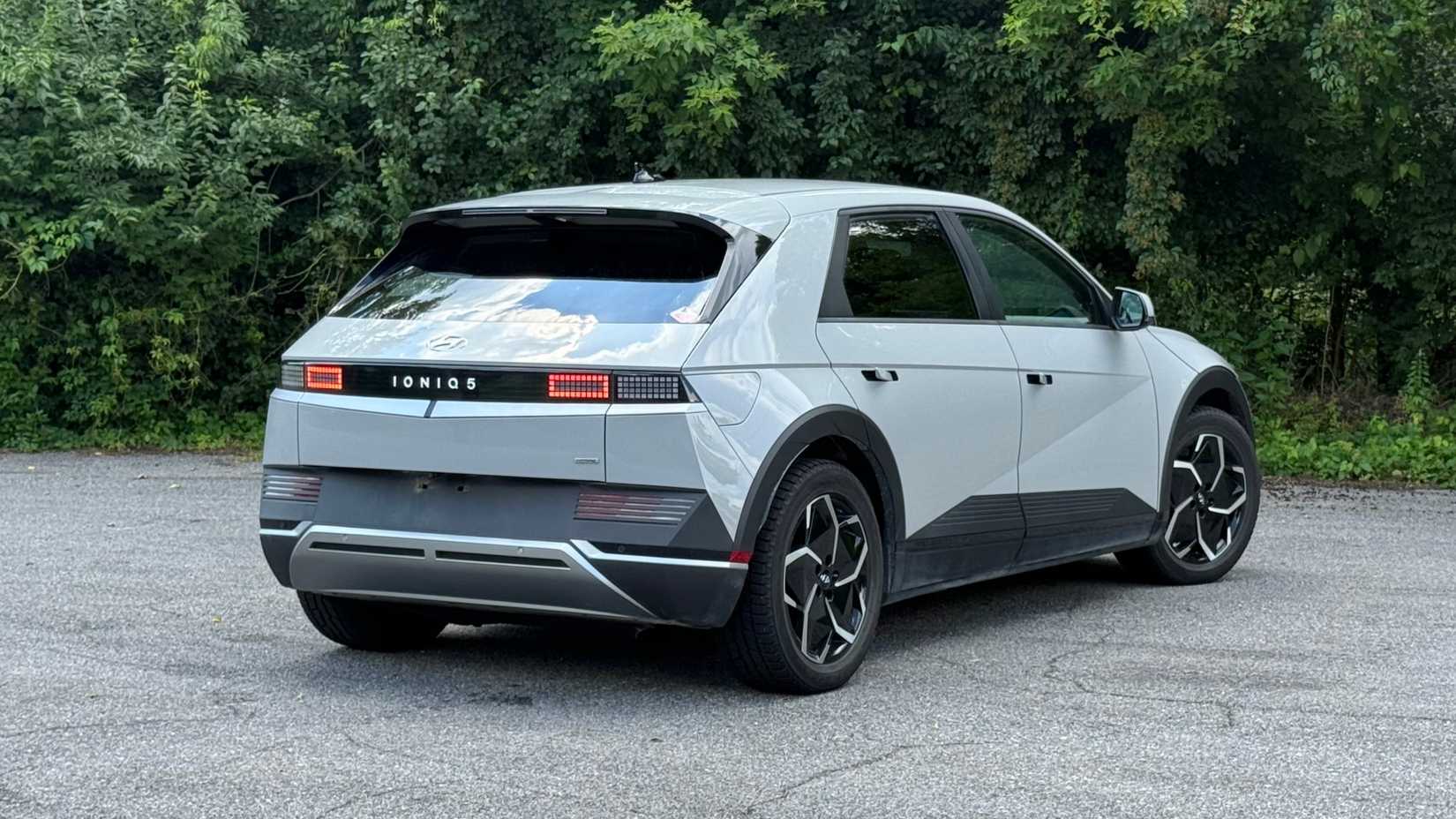A stationary rear three-quarters image of a gray 2022 Hyundai Ioniq 5 SE