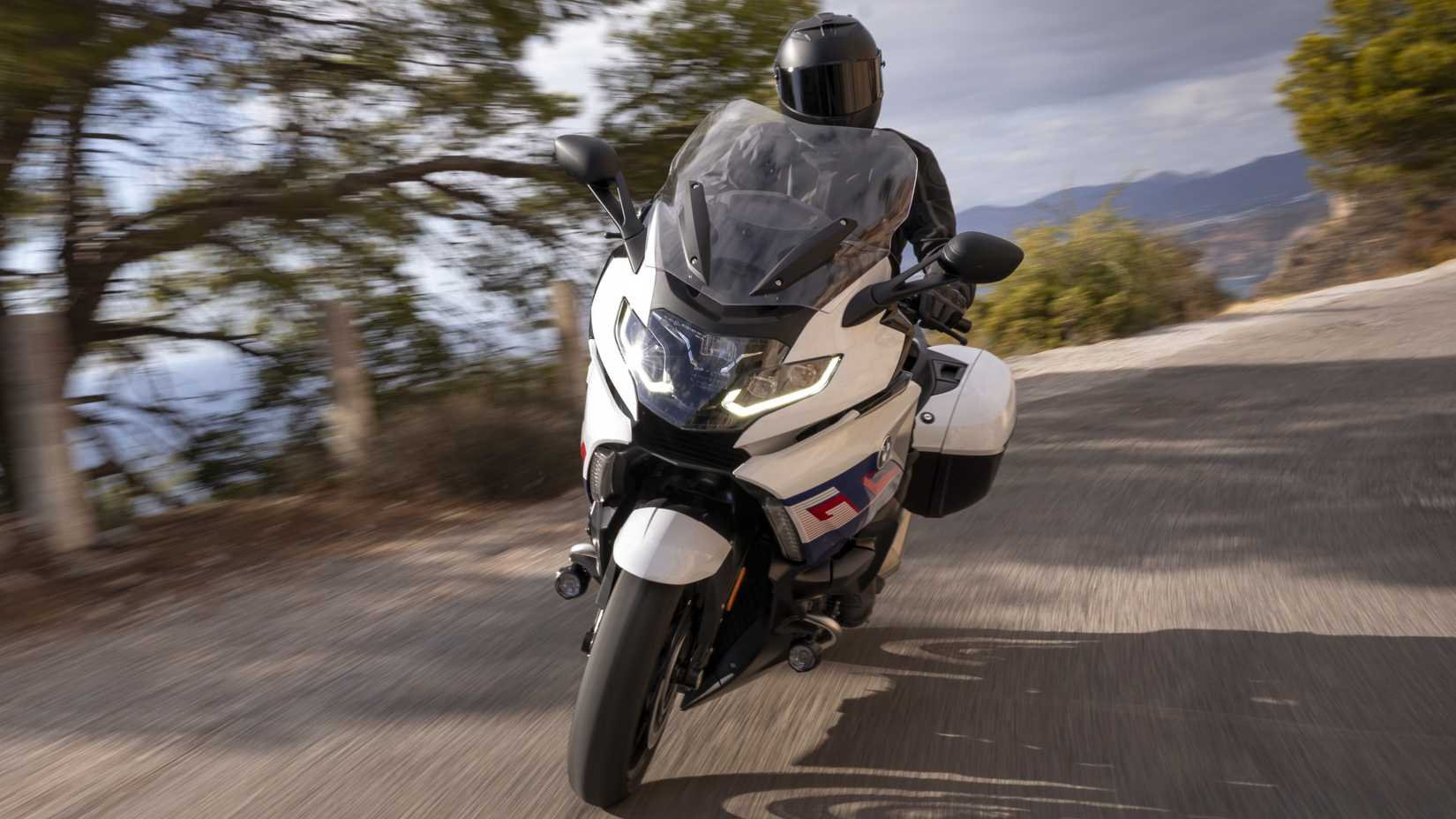 2025 BMW K 1600 GT on winding road front fascia view