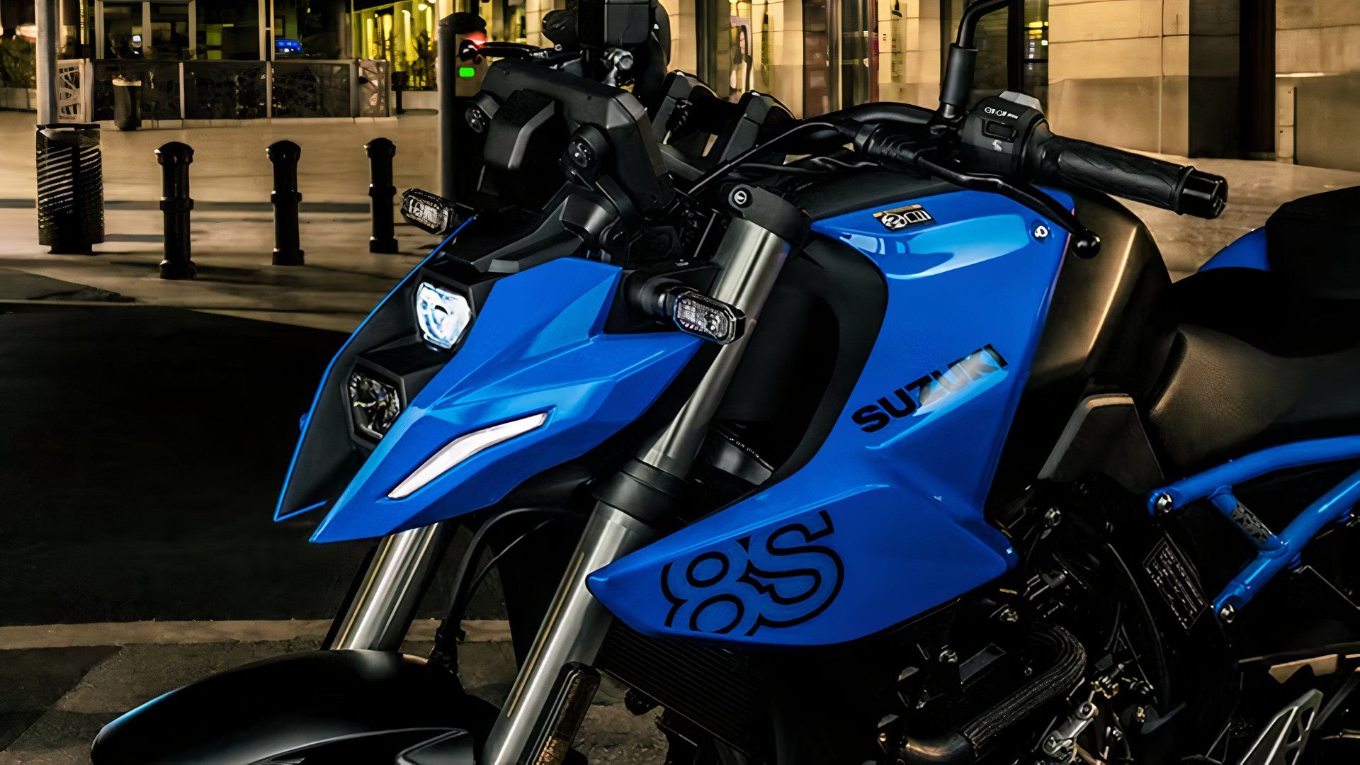 A close-up shot of the Suzuki GSX-8S headlamp