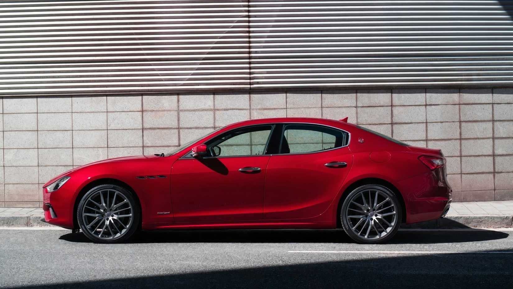 Profile shot of 2019 Maserati Ghibli in red parked