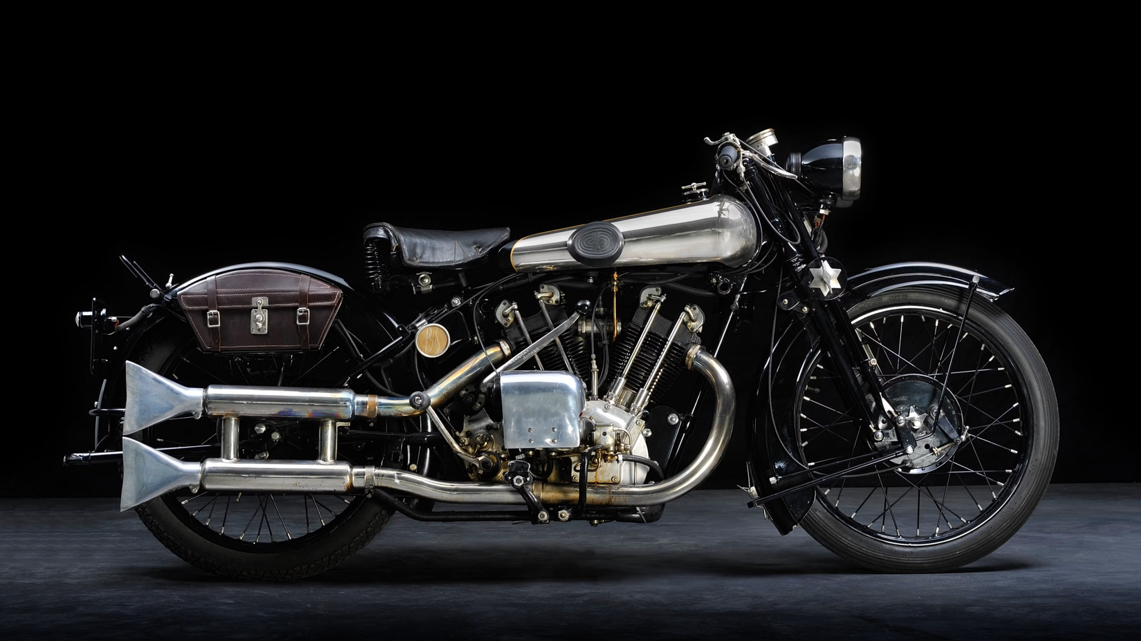 Right side shot of a black 1924 Brough Superior SS100 in a dark studio
