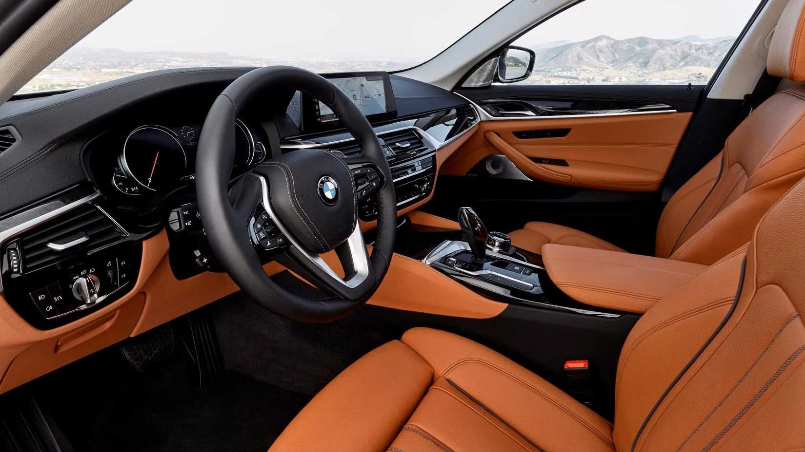 2020 BMW 5 Series interior shot showing front seats