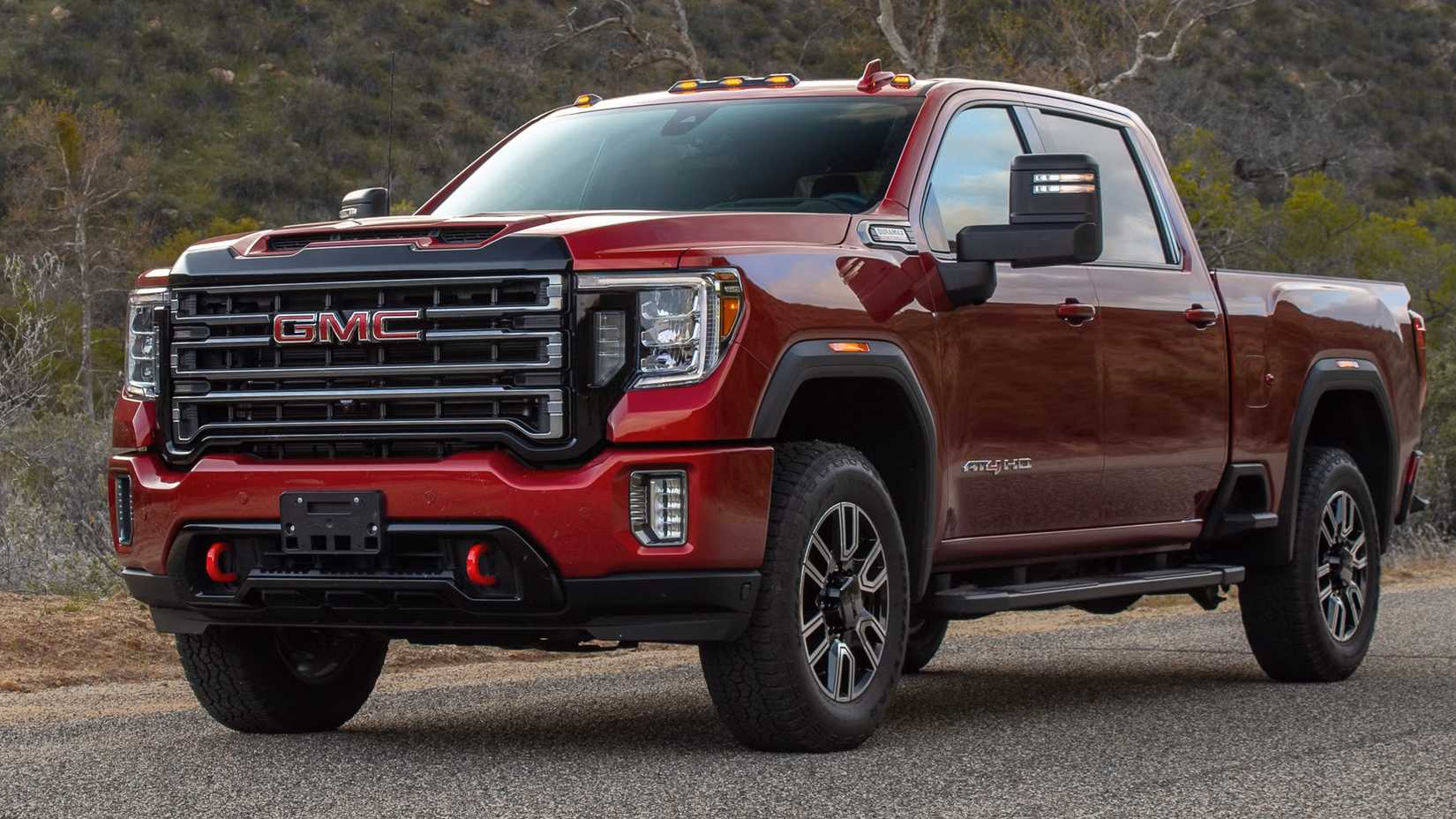 Red 2023 GMC Sierra 2500HD front 3/4 parked on the road