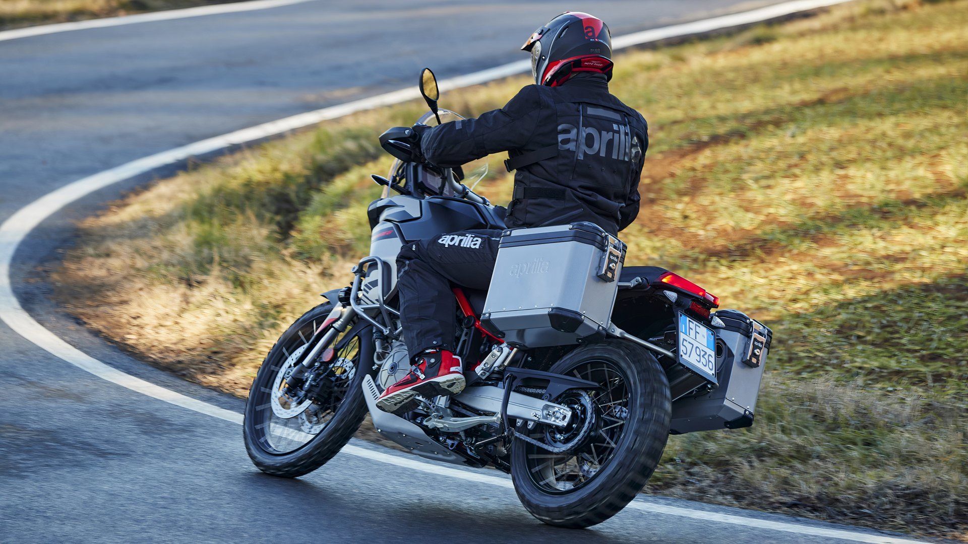 Aprilia Tuareg with panniers on the road rear third quarter view