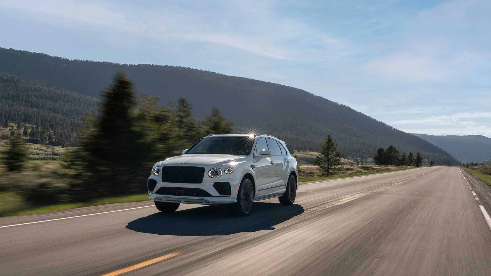 2025 Bentley Bentayga in white driving on road