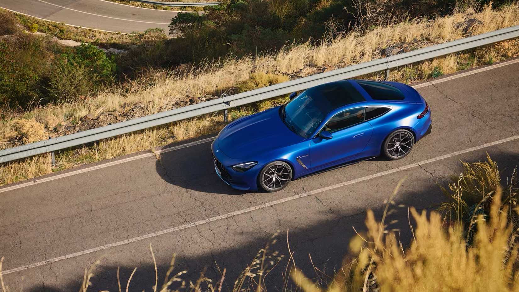 2025 Mercedes-AMG GT 55 Coupe in blue driving on road