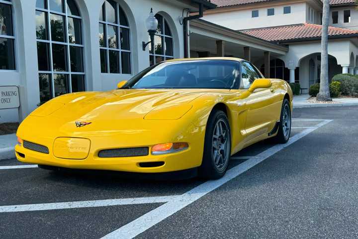 2002 Chevrolet Corvette Z06 in yellow parked in parking lot