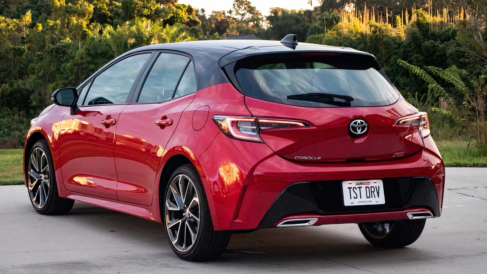 2025 Toyota Corolla Hatchback in red parked 