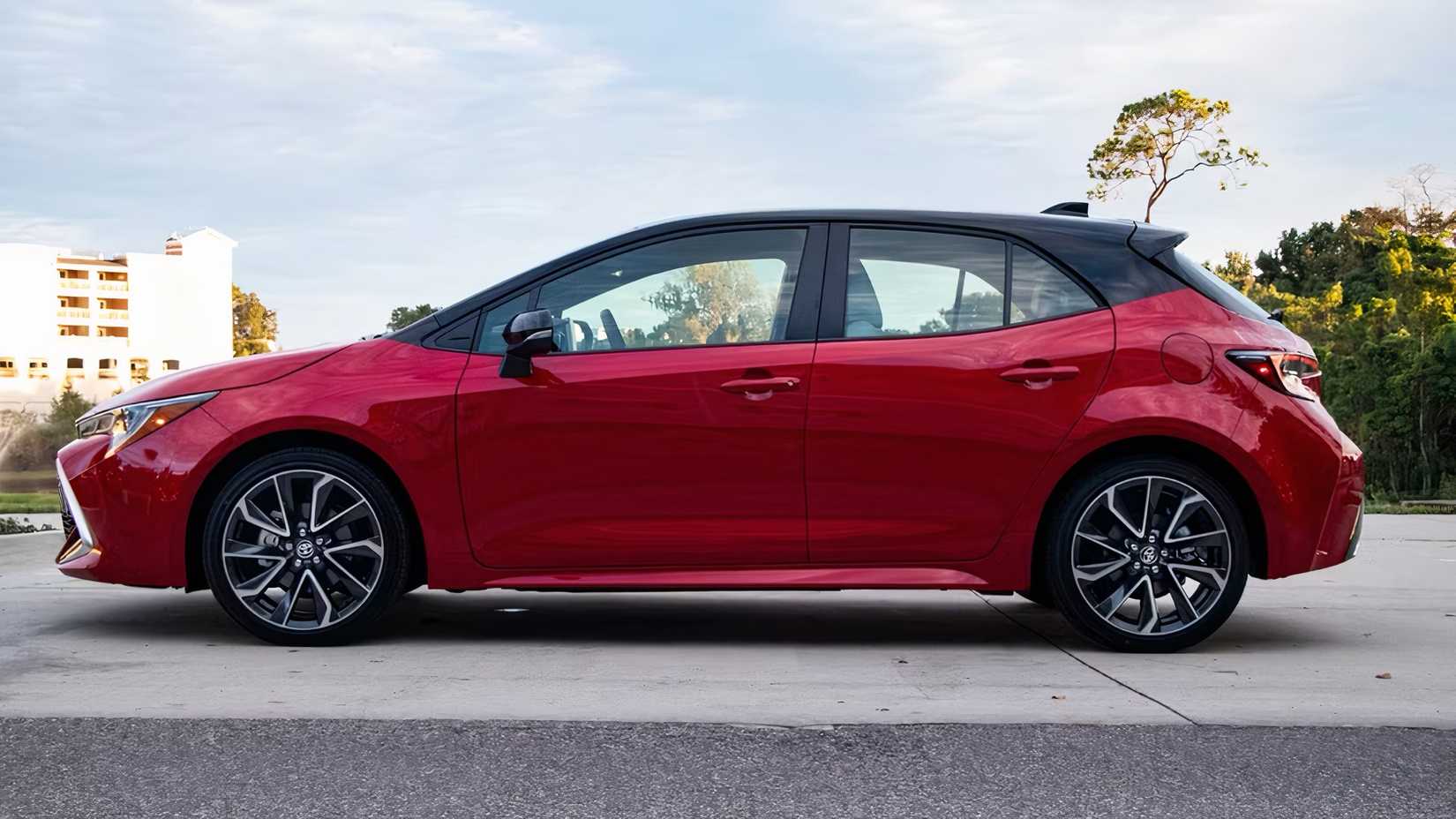 2025 Toyota Corolla Hatchback in red parked 
