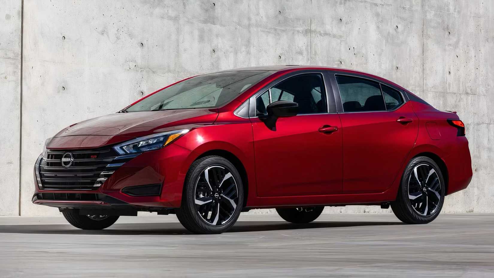2025 Nissan Versa in red parked 